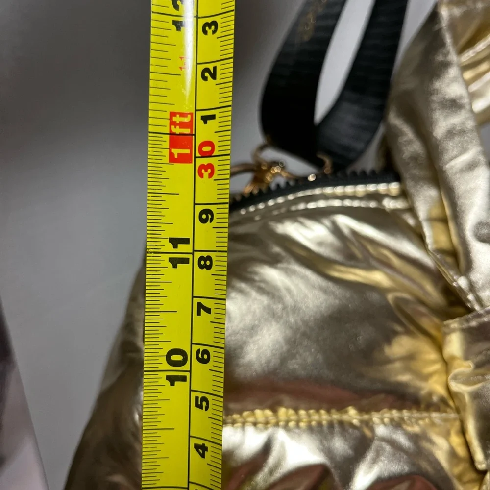 Justice Gold, metallic duffel bag